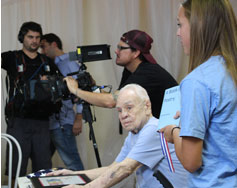 Liberty Club president, Isabella, presents Mick with bound copy of his poetry